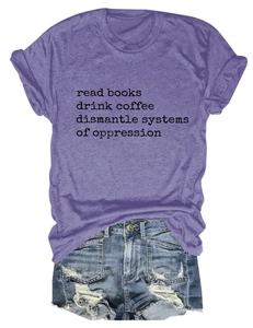 Detail of purple cotton t-shirt with black slogan print and distressed denim shorts