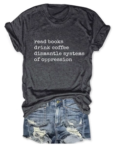 Detail view of cotton grey t-shirt with slogan and distressed denim shorts flat lay