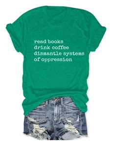 Detail of green cotton T-shirt with white typographic slogan and frayed denim shorts