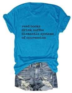 Flat lay of blue cotton t-shirt with slogan and distressed denim shorts with frayed edges
