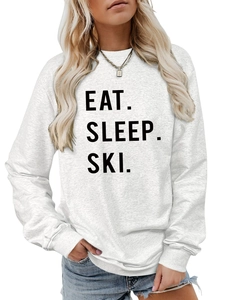 Close-up of Eat Sleep Ski bold letter print on a gray crewneck long sleeve sweatshirt