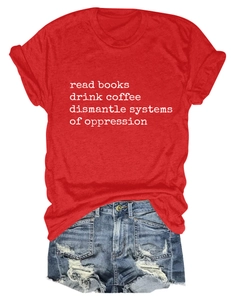 Macro detail of red cotton T-shirt featuring white slogan print and rolled sleeve texture