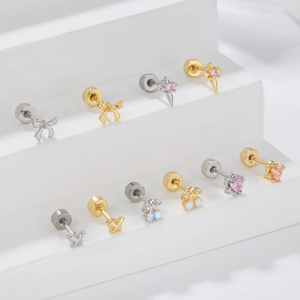Minimalist cartilage piercing stud set with zircon bow and star shapes in gold and silver
