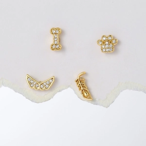 Golden 18K plated stainless steel stud earrings with zircon paw, wing and bone designs