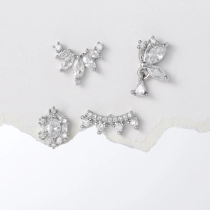 Set of four butterfly and geometric silver stud earrings with sparkling cubic zirconia