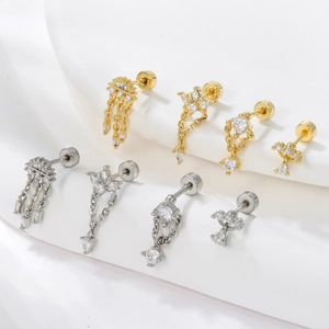 18k gold and silver earrings with zircons featuring tassel and cross pendants