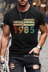 Close-up of vintage 1985 cassette tape print on men's relaxed-fit charcoal grey cotton T-shirt