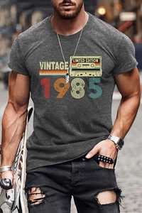 Close-up of vintage 1985 graphic print on a gray cotton t-shirt for men outdoors