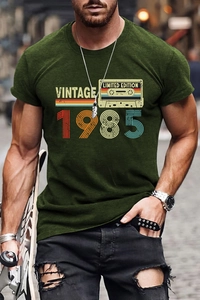 Detail view of vintage 1985 graphic print on men's relaxed dark green cotton T-shirt
