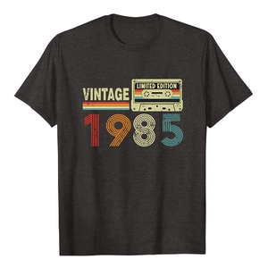 Close-up of vintage 1985 limited edition cassette graphic on dark grey cotton t-shirt
