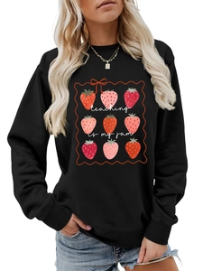 Front view of black sweatshirt with strawberry grid and Teaching is my jam text