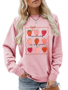 Detail of pink cotton sweatshirt with Teaching Is My Jam slogan and strawberry print
