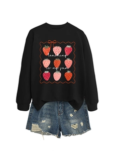 Flat lay of Teaching Is My Jam sweatshirt with strawberry print and ripped denim shorts