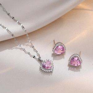 Pink heart zircon necklace and earrings set in silver-tone halo setting on silk