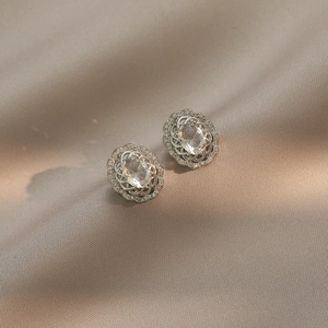 Vintage oval titanium steel earrings with large central zircon and halo design