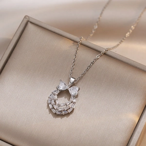 Bow-knot horseshoe pendant necklace with zircon crystals and silver-plated O-chain