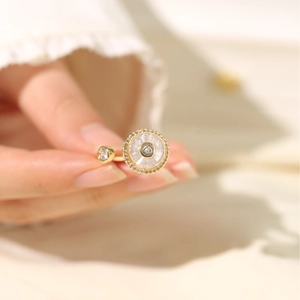 Detail of adjustable gold ring with sparkling zircon inlays and micro-pave setting