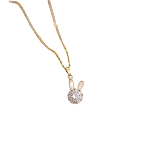 Golden rotating rabbit pendant necklace with sparkling zircon and pink shell details