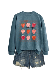 Detail of Teaching Is My Jam sweatshirt with strawberry print and frayed denim shorts