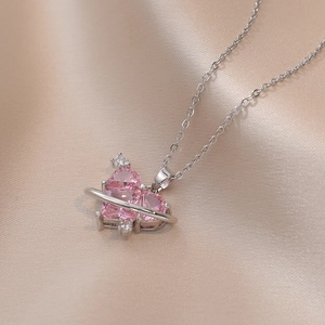 Pink heart zircon planet necklace with silver titanium steel chain on silk background