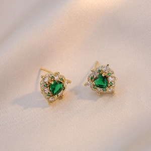 Luxurious gold heart earrings with emerald green crystals and micro-pave zircon detailing