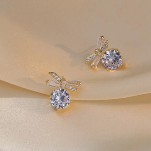 Elegant gold dragonfly stud earrings featuring sparkling zircon wings and large round gems