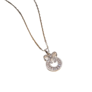 Elegant silver bow pendant necklace with zircon double ring design on white background