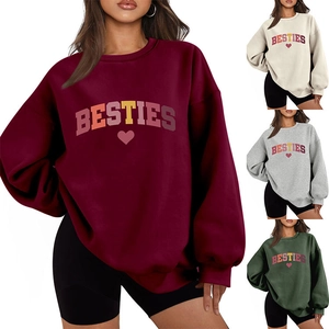 Detail view of BESTIES heart print on thick loose-fit long sleeve autumn sweatshirt