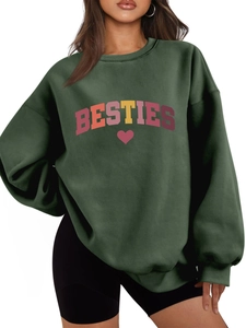 Detail view of the ribbed crewneck and BESTIES letter print on a green oversized sweatshirt