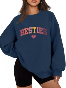 Close-up of navy blue crewneck sweatshirt featuring Besties text and red heart print