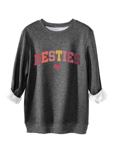 Detail of dark grey BESTIES sweatshirt showing thick warm white fleece lining and soft fabric