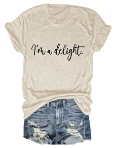 Detail of roll-up sleeves and 'I'm a delight' print on a casual beige t-shirt