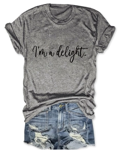 Close-up of grey 'I'm a delight' cotton t-shirt with ripped denim shorts set