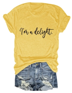Detail of yellow cotton T-shirt with I'm a delight print and ripped denim shorts