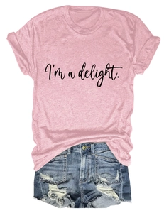 Flat lay of pink cotton T-shirt with I'm a delight print and ripped denim shorts
