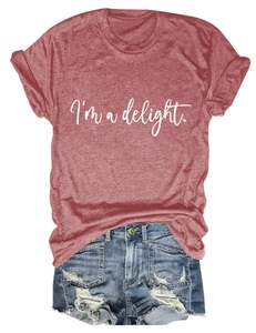 Flat lay detail of a red crew neck T-shirt with 'I'm a delight' text and ripped denim shorts