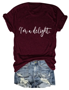 Detail of burgundy cotton T-shirt with white 'I'm a delight' print and ripped denim shorts