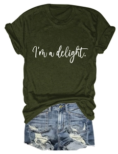 Close-up of dark green crew neck T-shirt with I'm a delight text and denim shorts