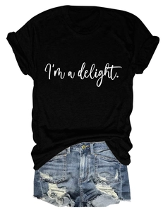 Detail of crewneck cotton T-shirt with I'm a delight text and frayed denim shorts