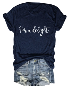 Flat lay of navy blue cotton T-shirt with I'm a delight text and distressed denim shorts