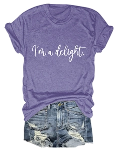 Close-up of heather purple T-shirt with 'I'm a delight' print and ripped denim shorts