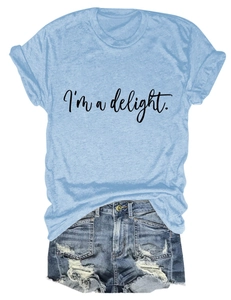 Detail of light blue crew neck T-shirt with I'm a delight text and distressed denim shorts