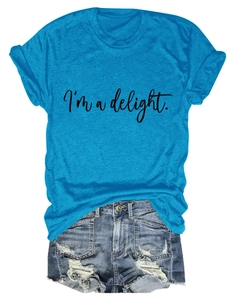 Flat lay of bright blue crew neck t-shirt with I'm a delight script and denim shorts