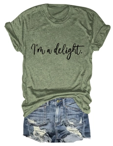 Close-up of grass green crew neck t-shirt with I'm a delight print and denim shorts