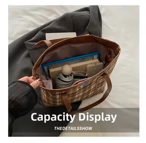 Capacity display of a brown plaid tote bag showing space for iPad, umbrella, and books