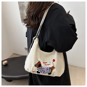Off-white corduroy hobo bag with dog embroidery and Happy Sumer text on back