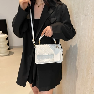 White quilted faux leather crossbody bag with top handle and mini pouch accessory