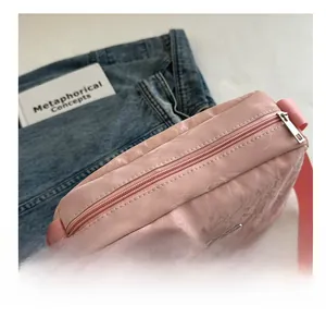 Top view of pink marble pattern shoulder bag with zipper and adjustable strap