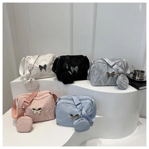 Chic butterfly buckle shoulder bag in five colors with a matching round mini coin purse pouch