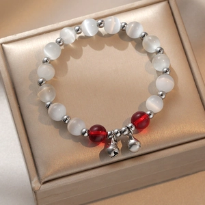 Bracelet En Perles D'Oeil De Chat Avec Pendentifs Cloches Argentés Bijoux Mode Style Niche Pour Femmes
